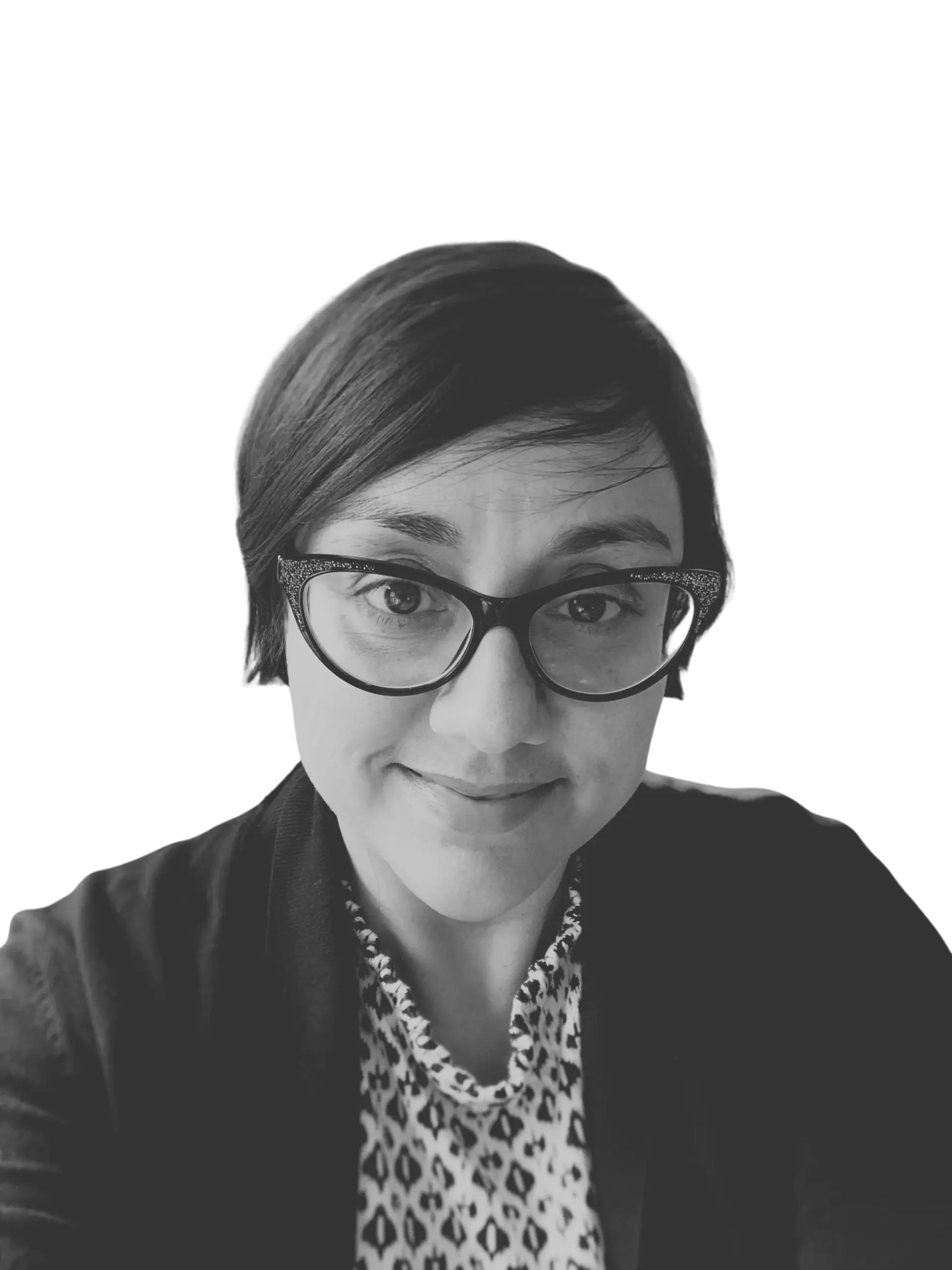 Xiomara Corpeño wearing glasses and smiling.