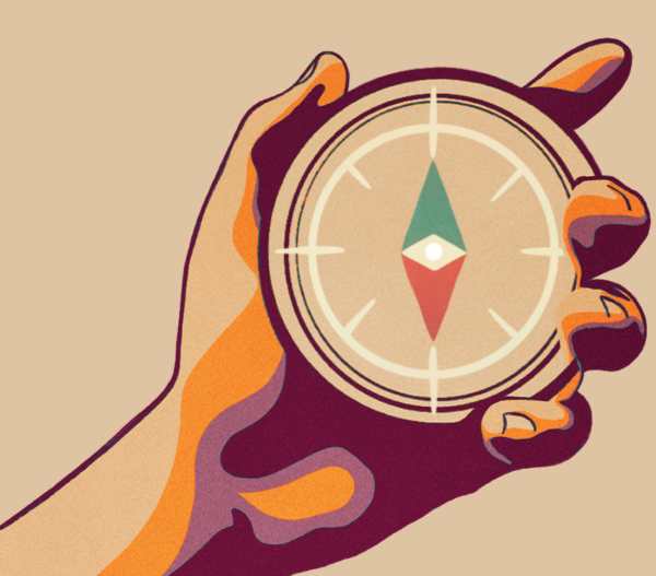 Hand holding compass